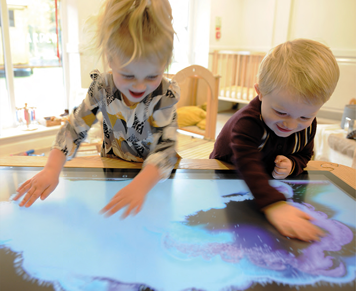 children using educational interactive table