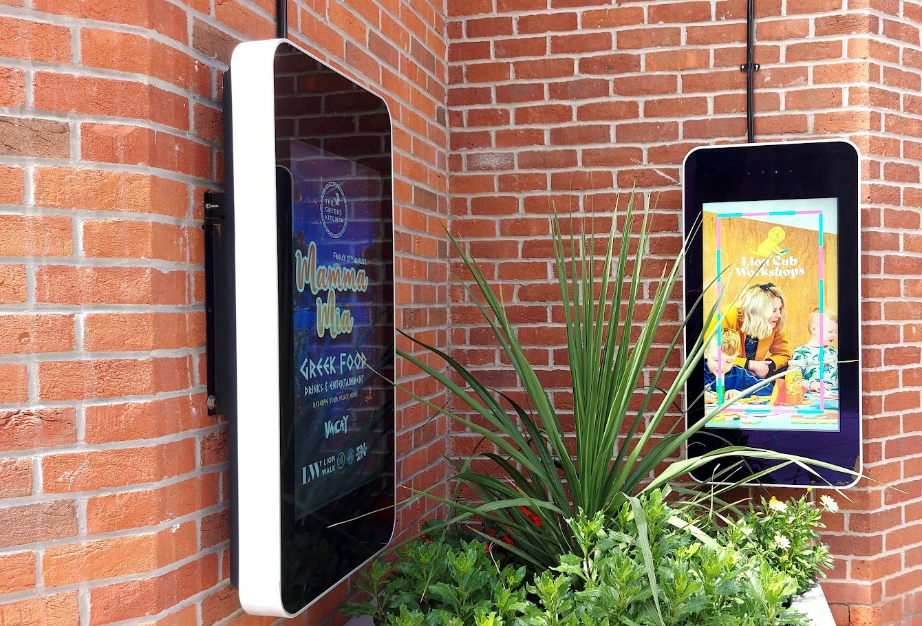 outdoor signage on the wall near shops