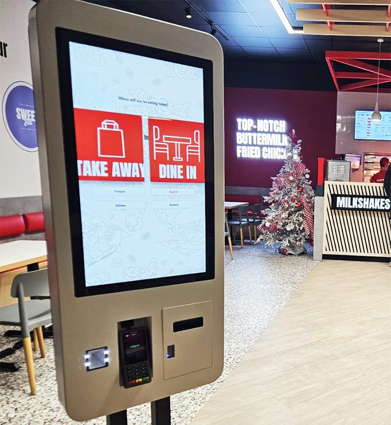 touchscreen self service kiosk in a fast-food restaurant for customer orders